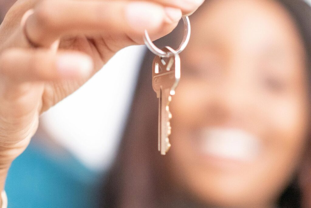 A person with a key in their hand for renting out their Property in Miami